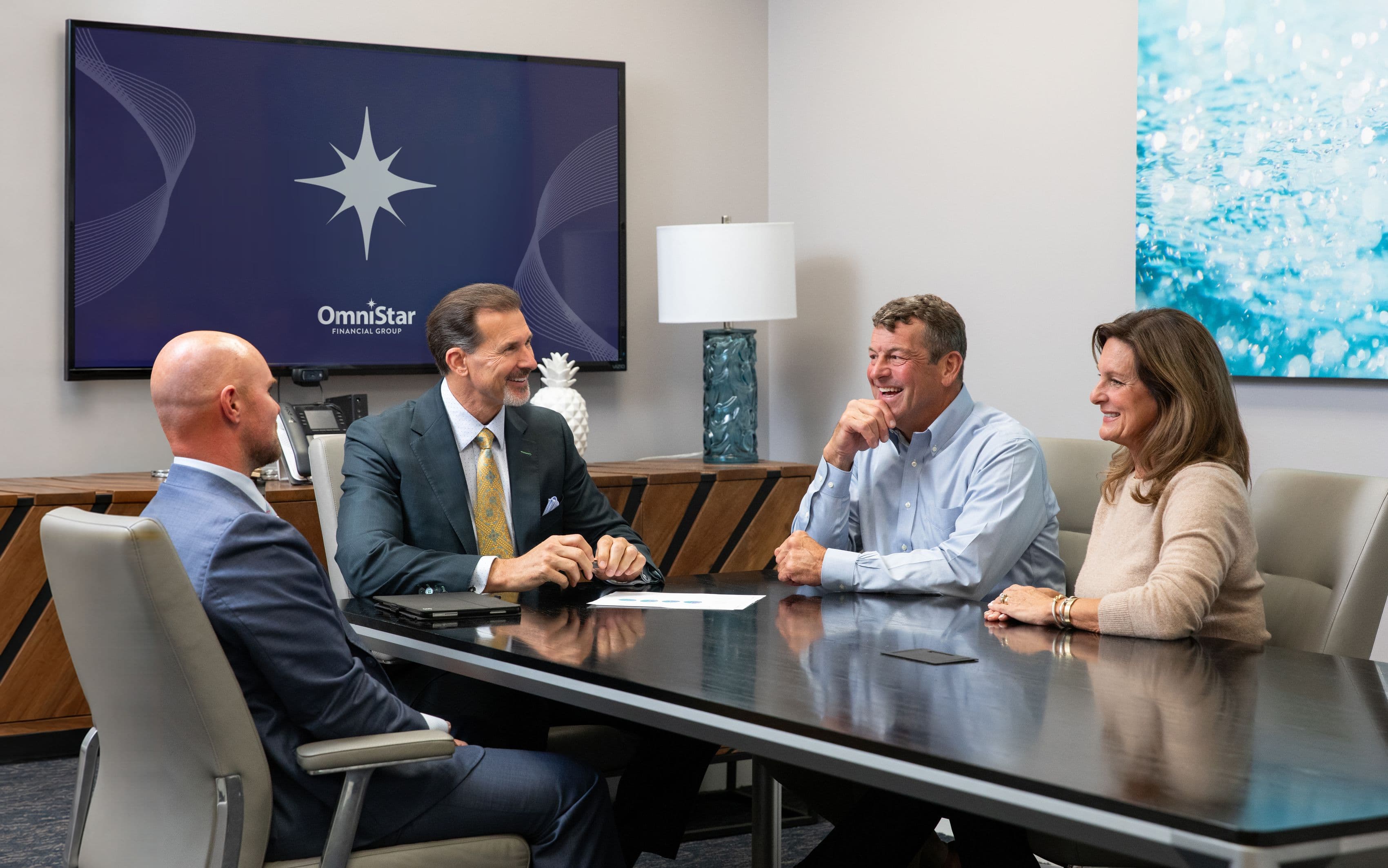 OmniStar advisors meeting with a client couple at the conference table
