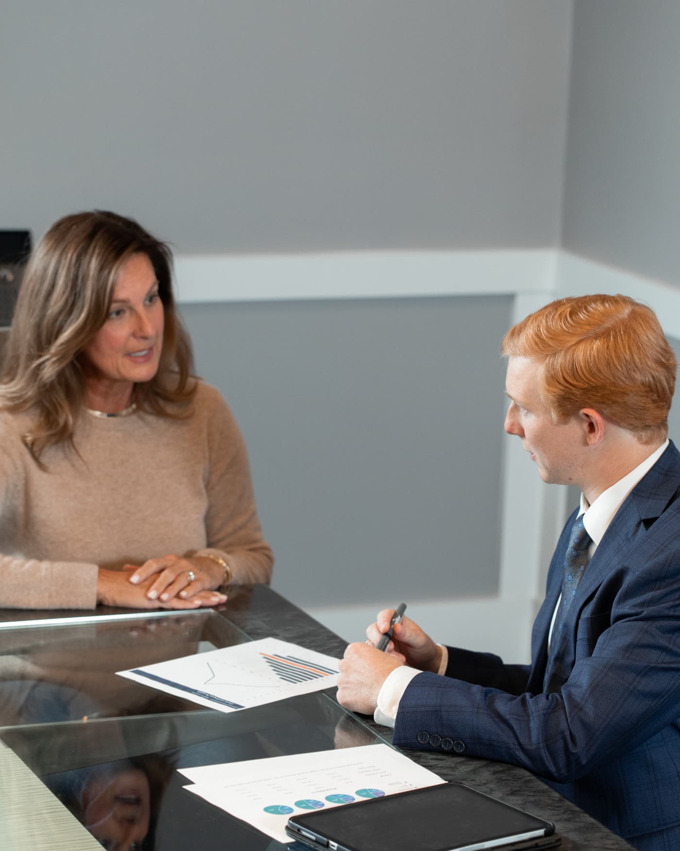 A business owner talking through her company's retirement plan with an OmniStar advisor