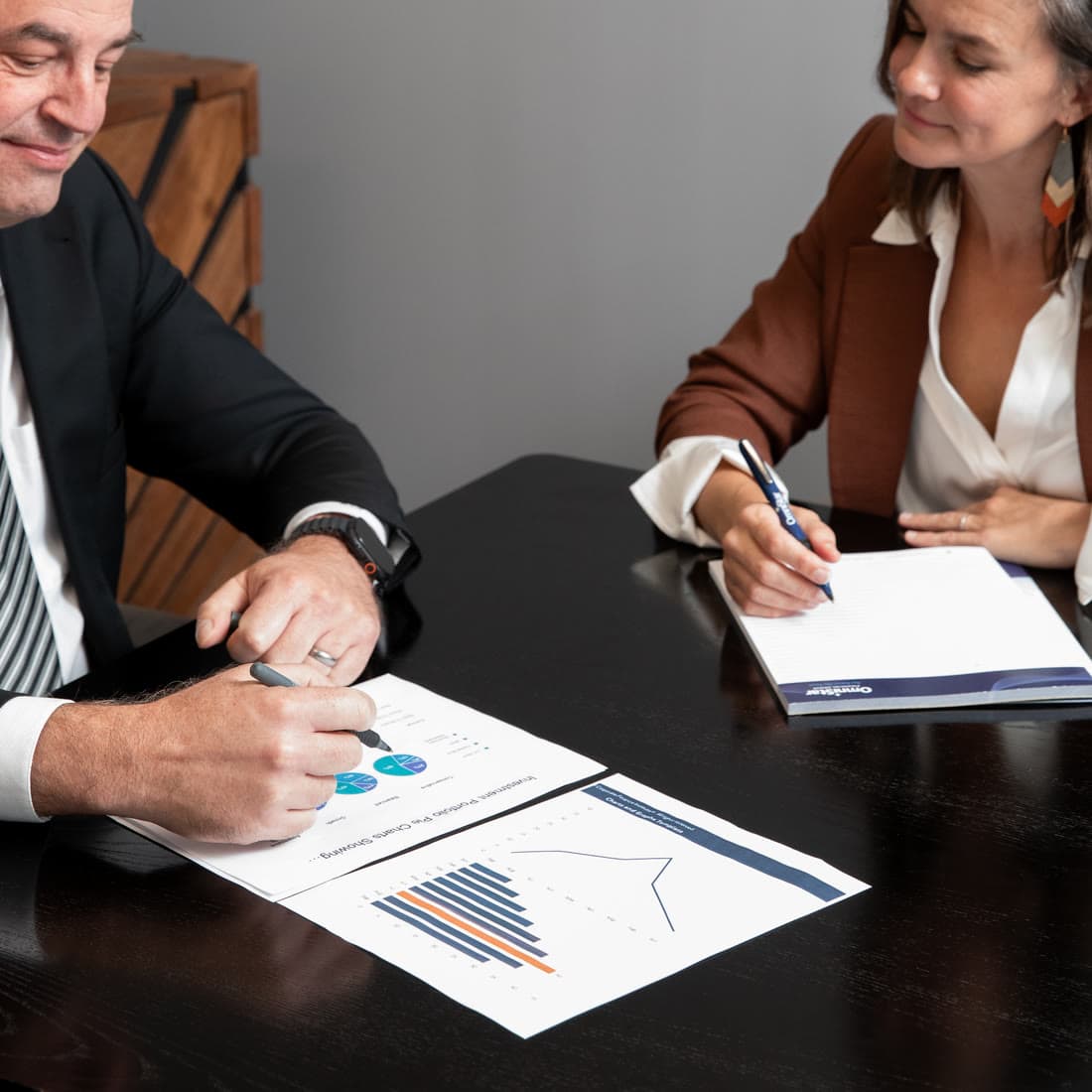 An advisor marking up a printed chart during a plan review