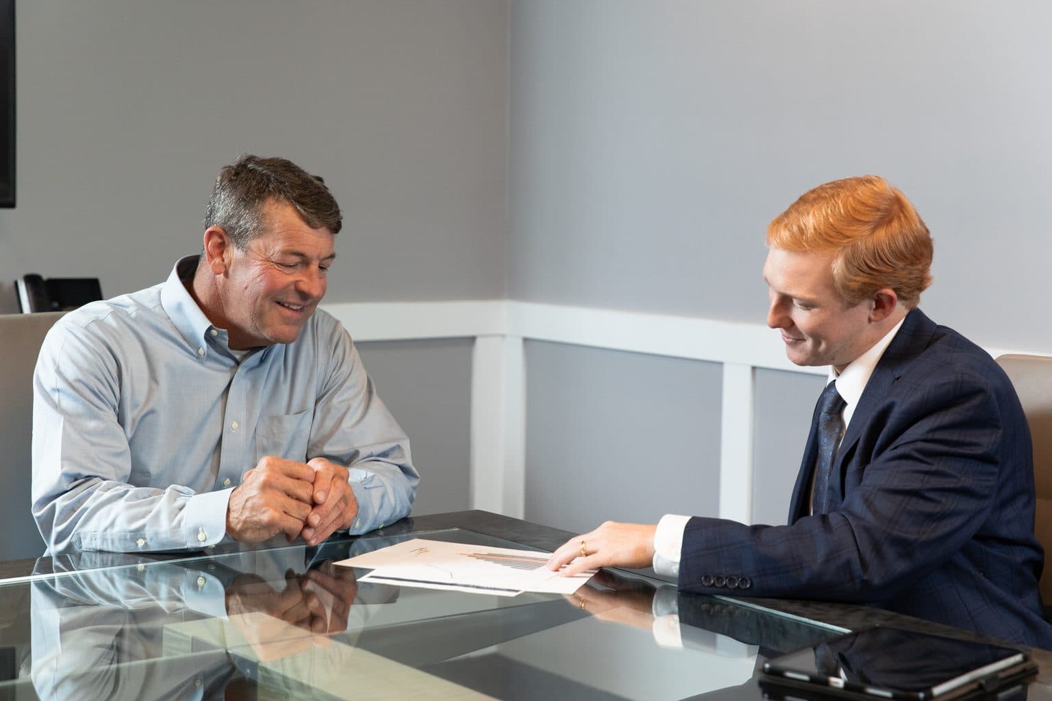 An OmniStar advisor reviewing a document with a client at the office