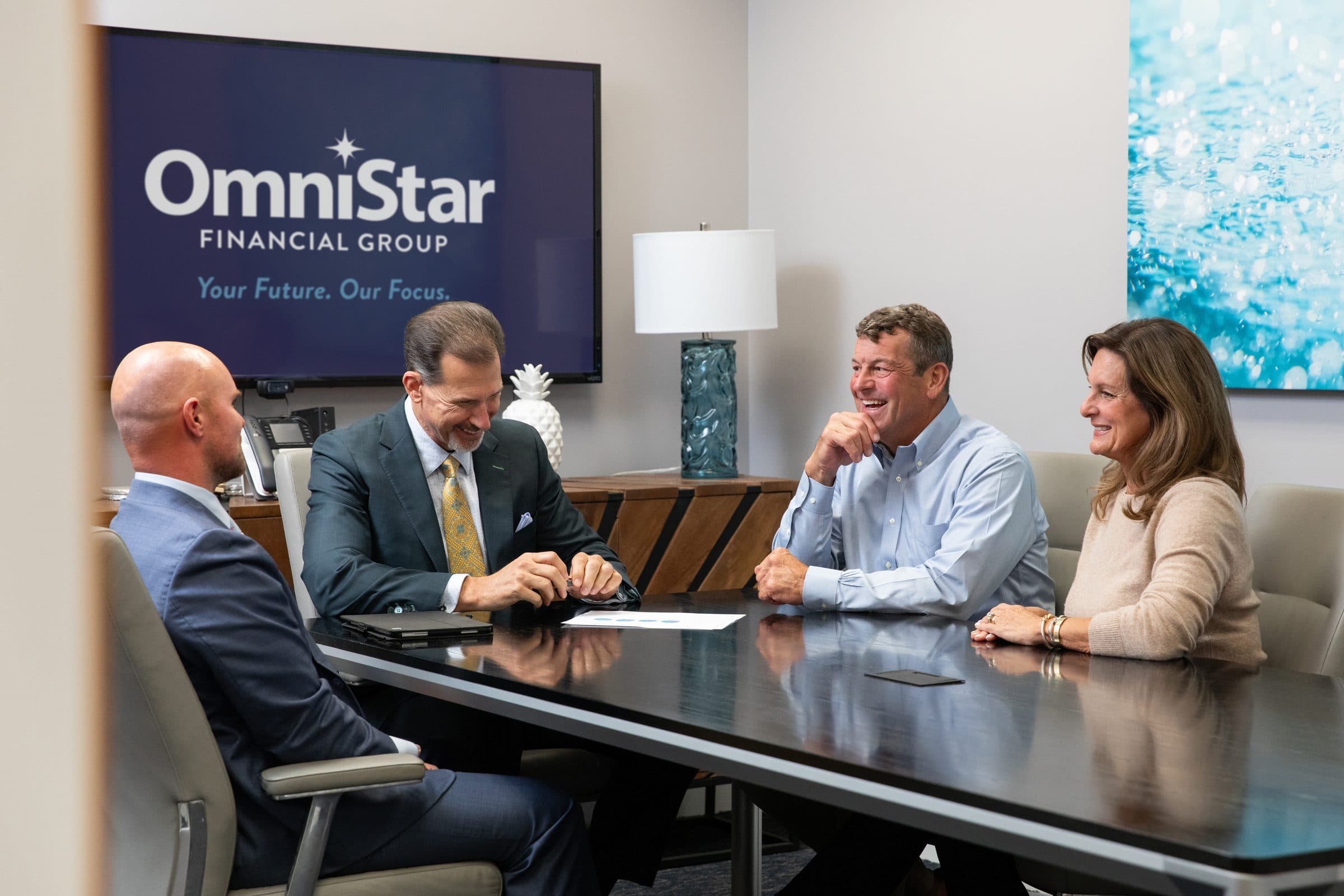 OmniStar advisors meeting with a client couple in the conference room at the Wilmington, North Carolina office