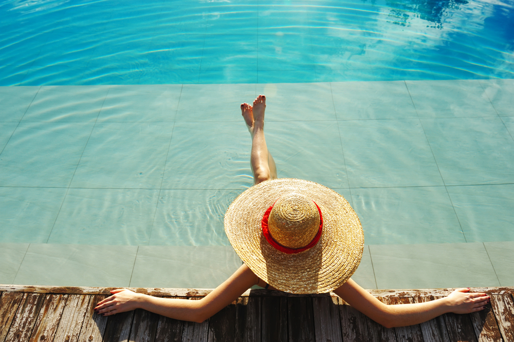 Woman relaxing by pool