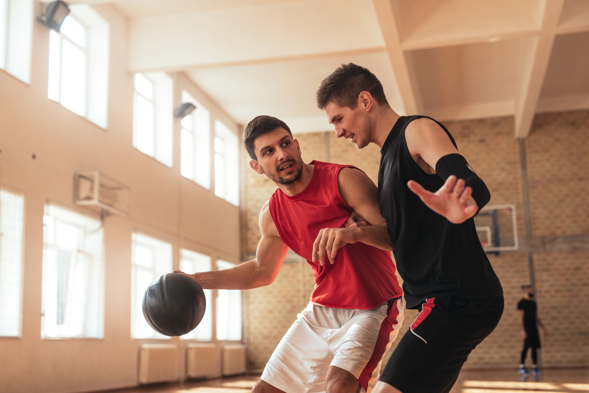 two guys playing basketball