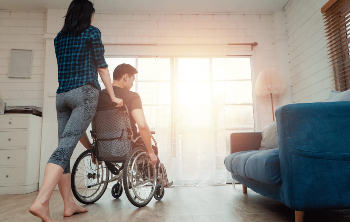 Pushing family member in wheelchair