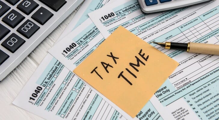 tax time memo on 1040 individual tax form picture id1178314435 1